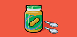 jar of peanut butter with two spoons