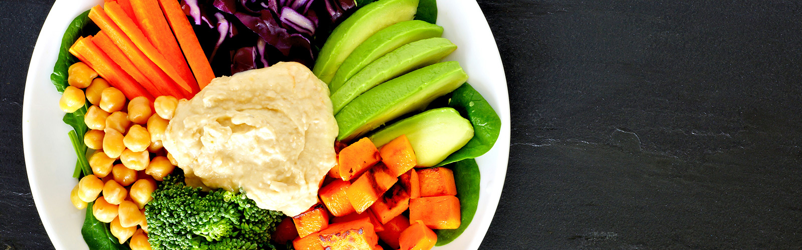 plates of veggies and hummus